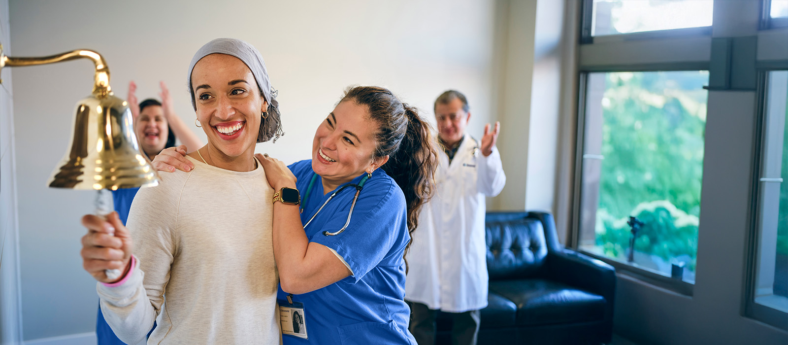 cancer patient ringing bell with nurse
