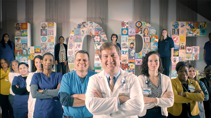 Healthcare team with arms folder