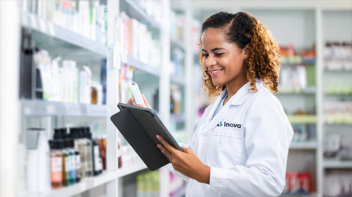 female pharmacist viewing tablet 