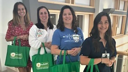 four smiling nurses